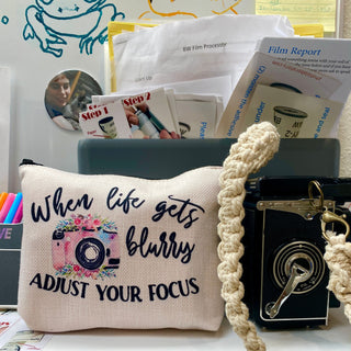 Original composition by Andrea McLaughlin featuring prints, a medium format camera and various forms for use by customers at Photolab Berkeley