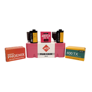 A bundled arrangement of film and essentials from Photolab, Harman Phoenix film, Kodak ProImage 100, Arista EDU DX 400, Portra 400 and Kodak 400TX with a JCH film case.