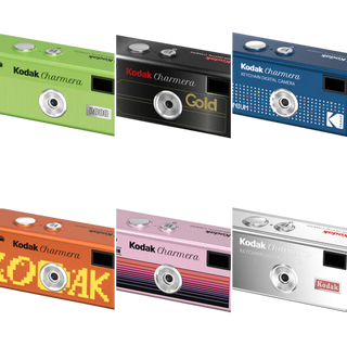 Six Kodak Charmera digital cameras arranged in a 2x3 grid on a white background, each in a different color: lime green, black, blue, orange, pink, and silver.