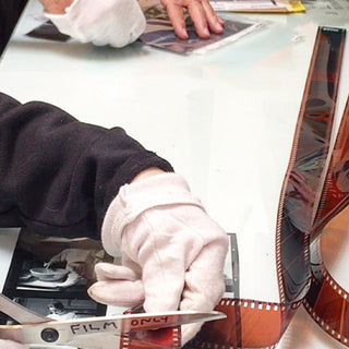 Technicians at Photolab Berkeley cut film with the authorized scissors labeled, "Film Only".