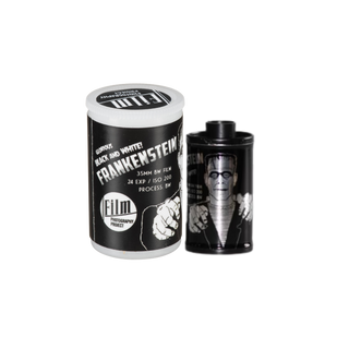 A 35mm DW Film Frankenstein special edition roll with its custom black and white canister packaging, featuring a graphic of the character on the label.