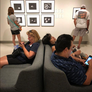 People enjoy the exhibit at the Berkeley Gallery at Photolab