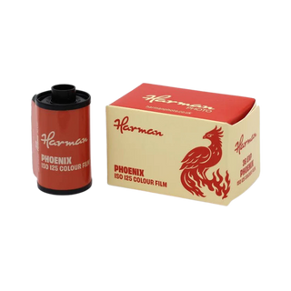 A roll of Harman Phoenix ISO 125 Colour Film standing next to its original red and cream packaging box on a plain white background.