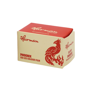 A boxed camera film canister for Harman Phoenix ISO 125 Colour Film, featuring a red top lid and a cream-colored body with a red phoenix logo and text.