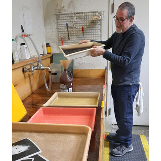 Joe Glass works in the darkroom at Photolab of Berkeley