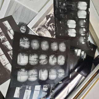 Various black & white contact sheets on a flatbed film cutter at Photolab of Berkeley