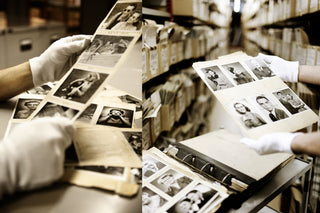 White gloved photo archivists work with various vintage black & white prints 