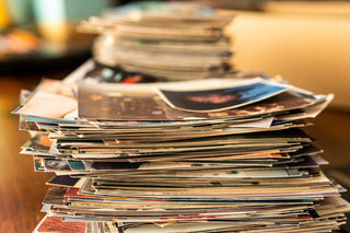 A stack of photos of various prints in preparation for a scanning project at Photolab of Berkeley