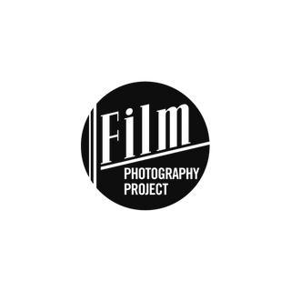 A circular black logo with white text reading 'Film PHOTOGRAPHY PROJECT' on a plain white background.